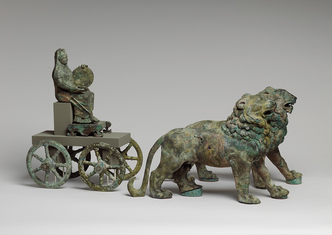 1280px-Bronze_statuette_of_Cybele_on_a_cart_drawn_by_lions_MET_DP307791